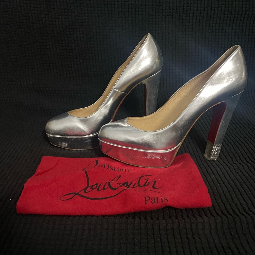 Louboutin Heels. Silver. Worn with some scratches